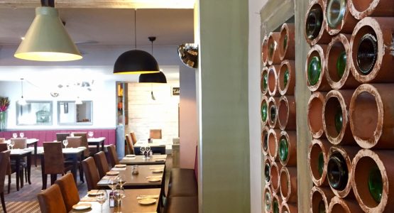 Pulcinella dining room with bottle storage wall detail